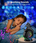Child sleeping under starry sky with Galaxy Star Projector Night Light For Bedroom With Timer And Remote 4 In 1 White Noise Bluetooth Speaker