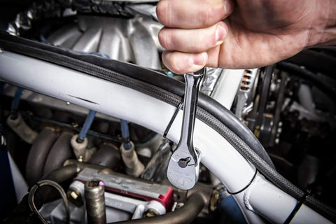 Three Eighth Inch Drive Ratchet And Drive Tools Set With Eighty Four Tooth Full Polish Chrome Ratchets in use on engine