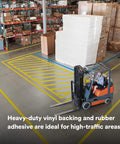 Warehouse floor with Durable Floor Marking Tape 971 Single Roll Yellow 4 in x 36 yd, used for designating forklift areas.