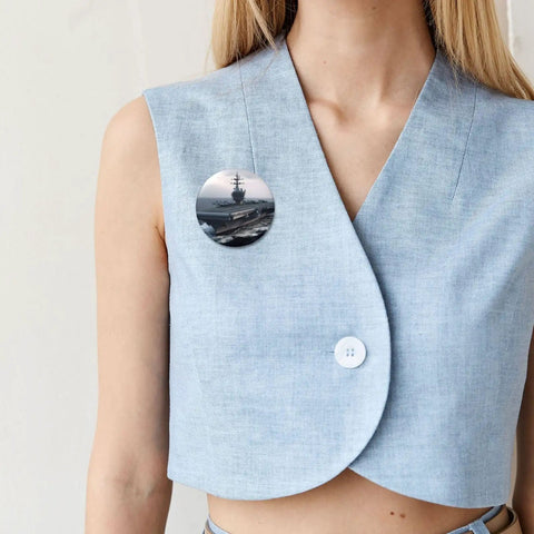Woman wearing a button pin featuring a ship design, part of the 12 Pack 2.4 Inch Round Button Pins Set Made From Durable Tinplate Metal With Custom Photo Prints.