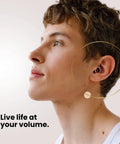 Person wearing Concert Ear Plugs With High Fidelity Hearing Protection And 18dB Noise Reduction, showing ear plug fit.