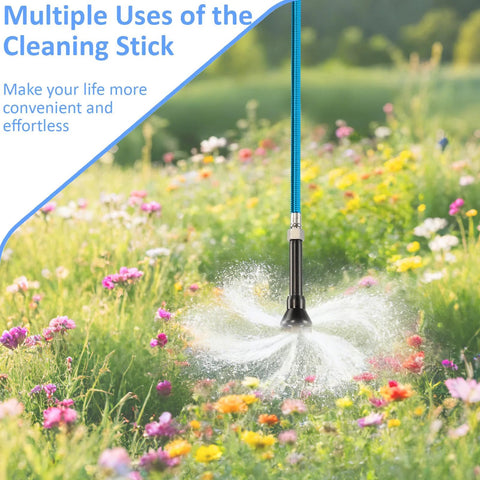 RV black tank cleaning wand with blue braided hose spraying water in a field of flowers