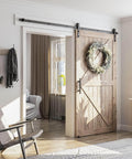Eight Point Two Foot Sliding Barn Door Hardware Kit With Smooth Quiet Track Easy To Install Includes Step By Step Installation Instructions Fits Forty Eight Inch Wide Door Panel J Shape Hanger Beefy Alloy Construction With Black Powder Coat installed in a living room
