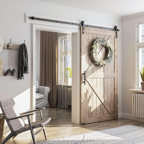 Eight Point Two Foot Sliding Barn Door Hardware Kit With Smooth Quiet Track Easy To Install Includes Step By Step Installation Instructions Fits Forty Eight Inch Wide Door Panel J Shape Hanger Beefy Alloy Construction With Black Powder Coat installed in a living room