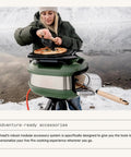 Person cooking with Tread Portable Pizza Oven Olive With Lateral Gas Burner Quick Heat Up Makes 12 Inch Pizzas Lightweight Yet Rugged
