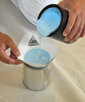 Man pouring blue paint through Durable Polyester Cone Paint And Stain Strainers, Fine Mesh 190 Micron, Easy Pour Cone Design