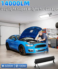 Mechanic working under Two Pack 100W LED Shop Lights 14000 Lumens 6000K Daylight Plug In Garage Lights in garage