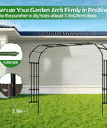 Ultra Wide Garden Arch Trellis 11.75ft By 8.53ft Sturdy Metal Outdoor Arbor installed on lawn, secured with ground punches