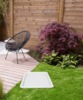 Garden scene with Path Maker Paver Mold For Garden, Reusable Outdoor Pavement Mold on grass near a wooden patio and chair