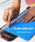 Using 12 Inch Paper Cutter For Scrapbooking And DIY Crafts With Smooth Sliding Guide Safe Blade Foldable Ruler for blue paper.