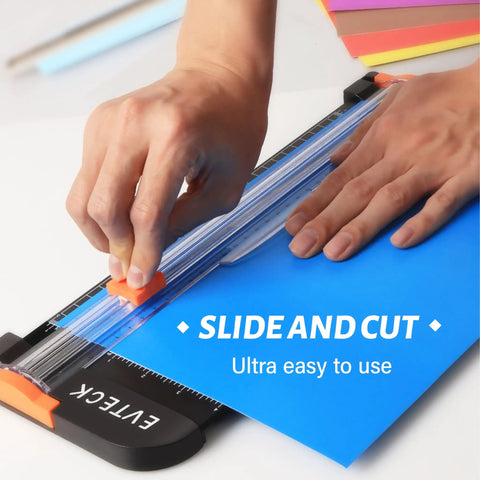 Using 12 Inch Paper Cutter For Scrapbooking And DIY Crafts With Smooth Sliding Guide Safe Blade Foldable Ruler for blue paper.