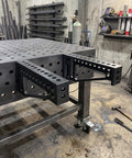Built Tough 12 Inch Welding Clamping Square And Table Extension Kit Featuring Precision Machined 90 Degree Positioning Riser Blocks on metal table.