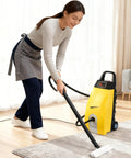 A woman using the Heavy Duty Commercial Steam Cleaner Beast Mode High Temp Pressure Washer For Kitchens And Auto Detailing Chemical Free No Fuss Deep Clean Kit With Rapid Heat And Wet Mop on a carpet.