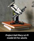 Project Hail Mary Microscale Spacecraft Model Collectible Set For Adults on display stand with books
