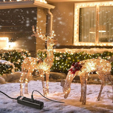 Weatherproof Outdoor Power Strip With Three Outlets And A Six Foot Extension Cord IPX6 Rated used in snowy yard with lit decor