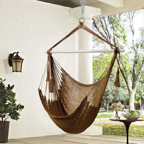 Caribbean Style Rope Hammock Chair With 40 Inch Steel Spreader Bar And Anti Slip Rings Soft Spun Cotton Rope For Indoor Outdoor Backyard Chill Relaxation Supports Up To 500 Lbs Tan hanging in a patio
