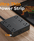 Heavy Duty Surge Protector Power Strip With An Incredibly Flat Plug 5 Foot Extension Cord In Black on wooden surface.