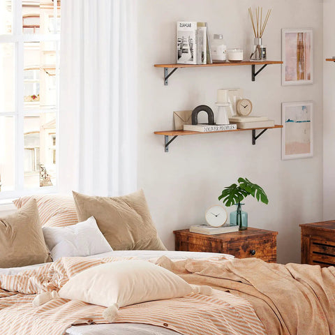 Pro Level Floating Wall Shelves Featuring Ridiculously Strong Metal Brackets And Zero Sag Particleboard Design For Bedroom Storage Or Bathroom Display Plus Straight Up Easy Hanging That Holds Up To 22 Pounds With Ease in a cozy bedroom setting.