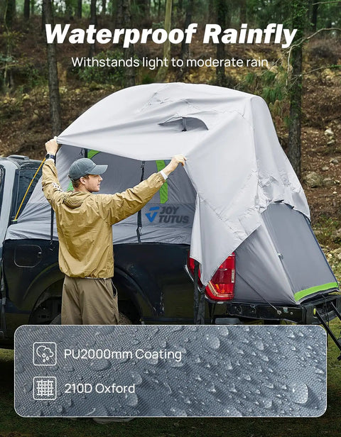 Man setting up Five Foot Pickup Truck Tent 2.0 Double Layer Waterproof PU2000MM with rainfly, 210D Oxford, on truck bed.