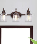 Adair 3 Light Bath Vanity Light in Oil Rubbed Bronze with Clear Glass Bell Shades 24 Inch Wide Transitional Indoor Fixture