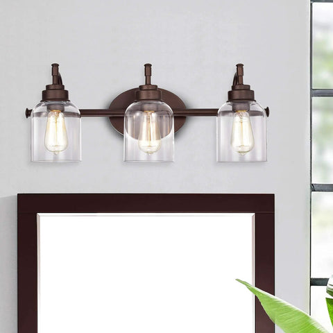 Adair 3 Light Bath Vanity Light in Oil Rubbed Bronze with Clear Glass Bell Shades 24 Inch Wide Transitional Indoor Fixture