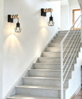BANGANMA 2 Pack Farmhouse Wall Sconces, Hardwired E26 Wood Cage for Bedroom illuminating a modern staircase.