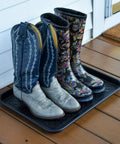 Two Pack Boot Tray Organizer For Shoes And Boots 20 By 15 Inches Heavy Duty Flex Plastic holding cowboy boots on porch