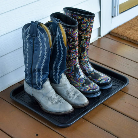 Two Pack Boot Tray Organizer For Shoes And Boots 20 By 15 Inches Heavy Duty Flex Plastic holding cowboy boots on porch