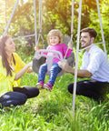 3 In 1 Toddler Swing Set For Backyard And Indoor Use with child seated, black frame, and detachable modes, outdoor setting.