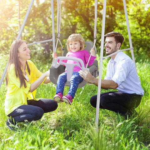 3 In 1 Toddler Swing Set For Backyard And Indoor Use with child seated, black frame, and detachable modes, outdoor setting.