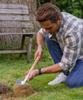 Man using 19.8 Inch Round Point Digging Shovel With Wood Handle Stainless Steel Spade Pro Grade for gardening on lawn