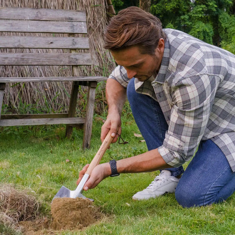 Man using 19.8 Inch Round Point Digging Shovel With Wood Handle Stainless Steel Spade Pro Grade for gardening on lawn