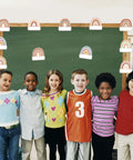 Children in front of chalkboard with Rainbow Cutouts For Classroom Decor, 45 Pcs Boho Rainbow Name Tags With 100 Glue Dots