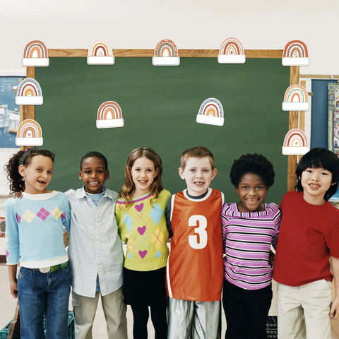 Children in front of chalkboard with Rainbow Cutouts For Classroom Decor, 45 Pcs Boho Rainbow Name Tags With 100 Glue Dots
