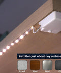 Battery Powered LED Strip Lights 40 Inch 3 Pack Wireless Under Cabinet Lighting on wood surface with adhesive backing
