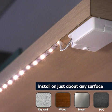 Battery Powered LED Strip Lights 40 Inch 3 Pack Wireless Under Cabinet Lighting on wood surface with adhesive backing