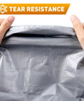 Hands demonstrating tear resistance of Heavy Duty Waterproof Camping Tarp 10x20 Ft Thick 16 Mil With 15x17 Weave.