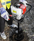 Person using Gas Powered Earth Auger With 6 Inch Digger Bit For Post Holes And Tree Planting, 2 Stroke Engine, Heavy Duty