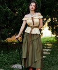 Badass Medieval Leather Belt For Renaissance Cosplay And Hella Cool Pirate Viking Props Featuring Embossed Buckle With Adjustable Waist Strap on a model dressed in a peasant outfit.