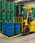 Spill Containment Tray With Drain, Heavy Duty 51x51x6 Inch Platform holding four blue drums on forklift in warehouse.