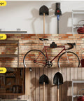 Wall-mounted garage tool organizer trimmer rack holding a grass trimmer and garden tools, shown in a storage and garden setting.