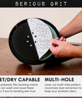 Person holding Heavy Duty 9-Hole 40 Grit Drywall Sanding Discs for Festool Planex LHS 225 with hook and loop backing, 225mm.