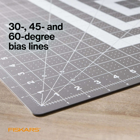 Fiskars cutting mat, 24 x 36 inches, gray self-healing with grid and 30-, 45-, 60-degree bias lines; Fiskars logo