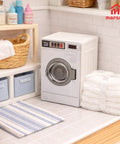 Big Time Hit Miniature Washing Machine Featuring Smooth Operable Lid And 1/12 Scale White Towel Set Serious Flex For Dollhouse Furniture And Cozy Room Decor Display Collection placed in a cozy laundry setup.