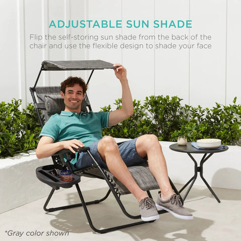 Man relaxing on Zero Gravity Outdoor Folding Recliner Lounge Chair With Adjustable Canopy Shade Headrest And Side Tray, Ice Gray