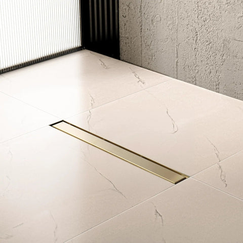 Rugged 42 Inch Linear Shower Drain With Flip Style Tile Cover And Sleek Satin Brass Trim Crafted From Bulletproof 304 Stainless Steel Plus Integrated Hair Catcher And Dead Simple Mounting Kit For No Sweat Bathroom Projects on tiled floor.