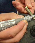 Permatex Anti-Seize Lubricant 1 oz tube; gray label with blue logo, applied to a threaded bolt.