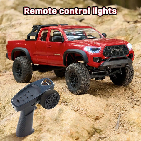 Toyota Licensed FCX24M 1 24th Scale RC Crawler Tacoma Style Rock Truck With Realistic ABS Hard Body in red on rocks