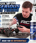 Person using Rock Hard 2 Oz Rc Differential Oil 500K Cst Silicone Fluid for tuning RC car gears in a workshop.