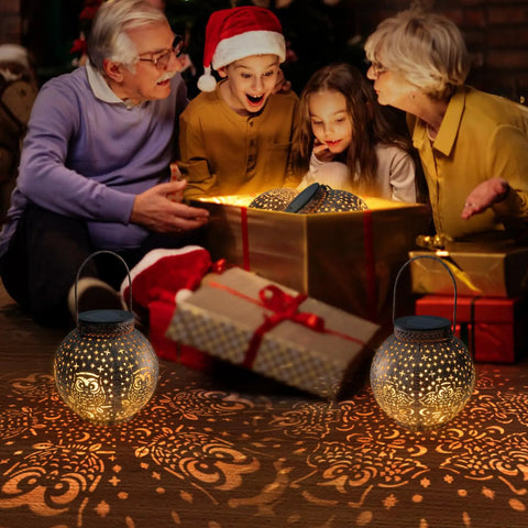 Family admiring gifts with glowing Outdoor Solar Lanterns With Cute Owl Cutouts Two Pack Waterproof Garden Decor lights